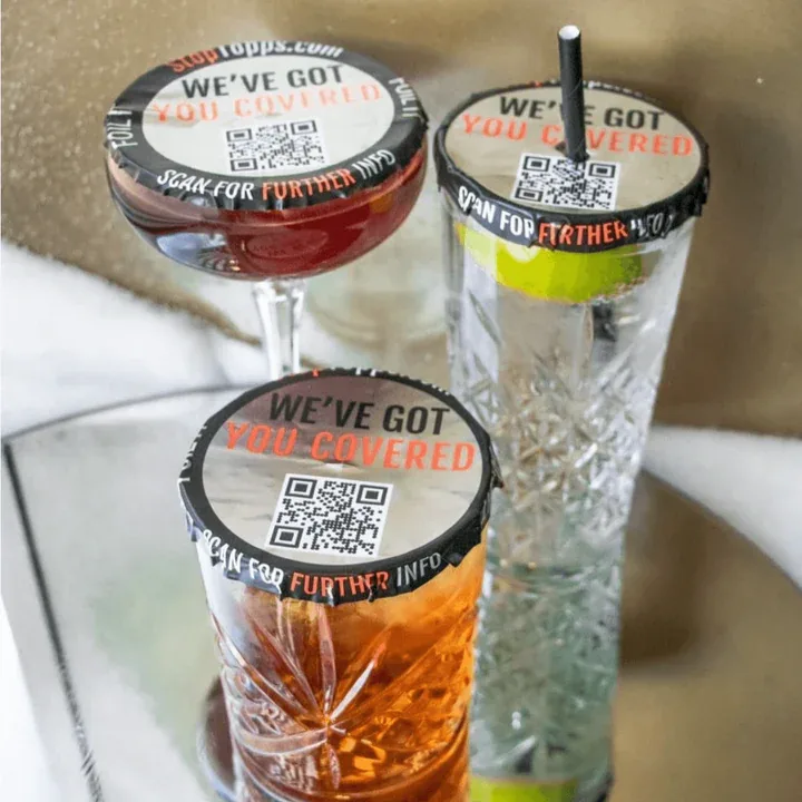 StopTopps covers fitted to two drinks